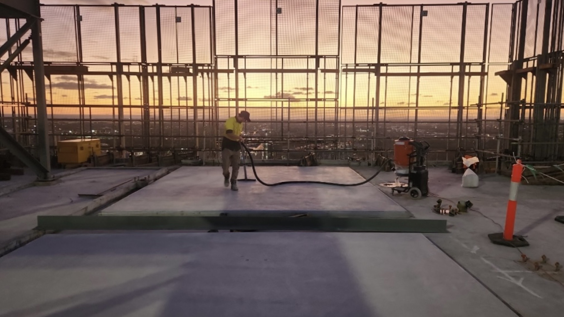 Floortek crew applying waterproofing membrane on the Adelaide Festival Tower rooftop deck