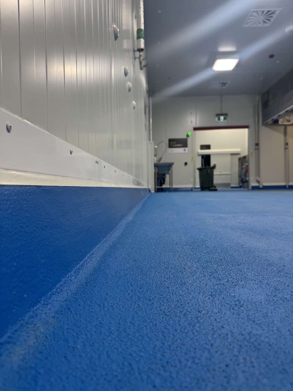 Polyurethane cement coved skirting — Haigh's Chocolates food-safe floor finish