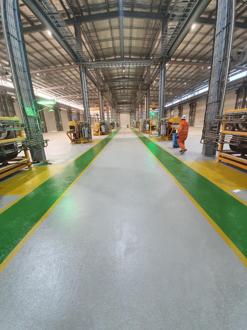 Completed epoxy floor coating with safety line marking — Olympic Dam Surface Workshop