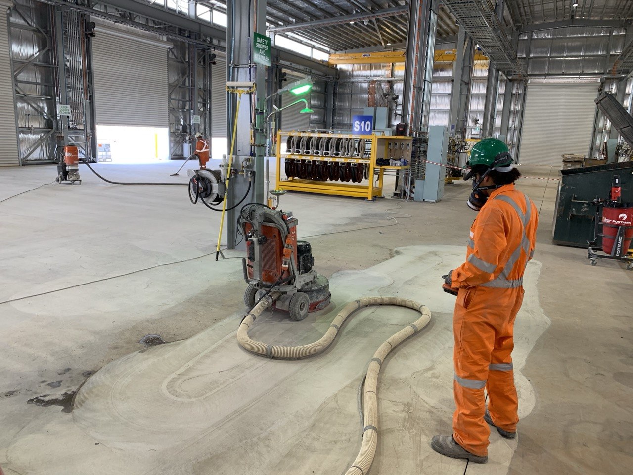 Concrete surface preparation in progress — Olympic Dam mine workshop Adelaide