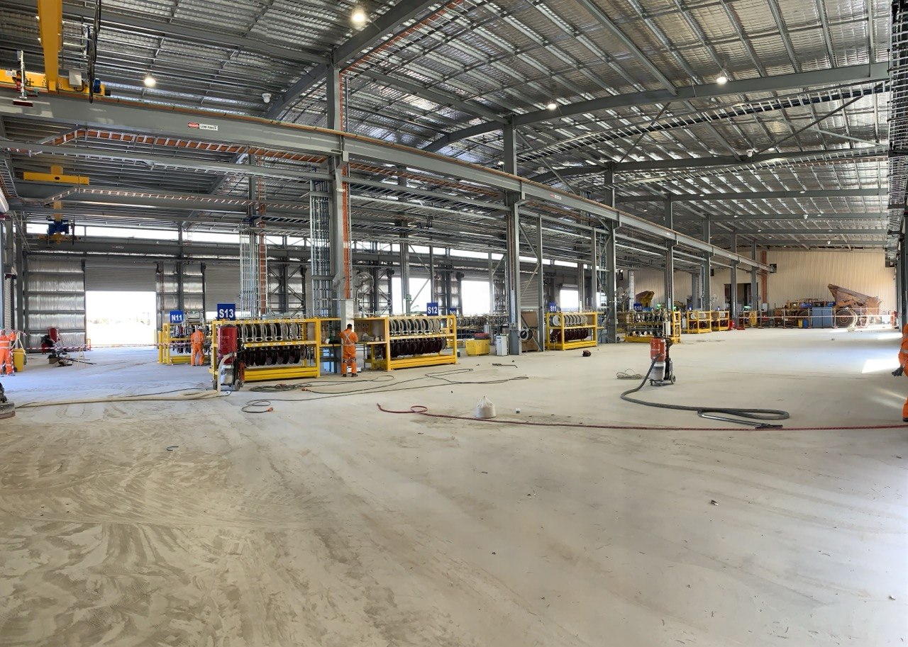 Floortek crew surface grinding — Olympic Dam Surface Workshop Expansion