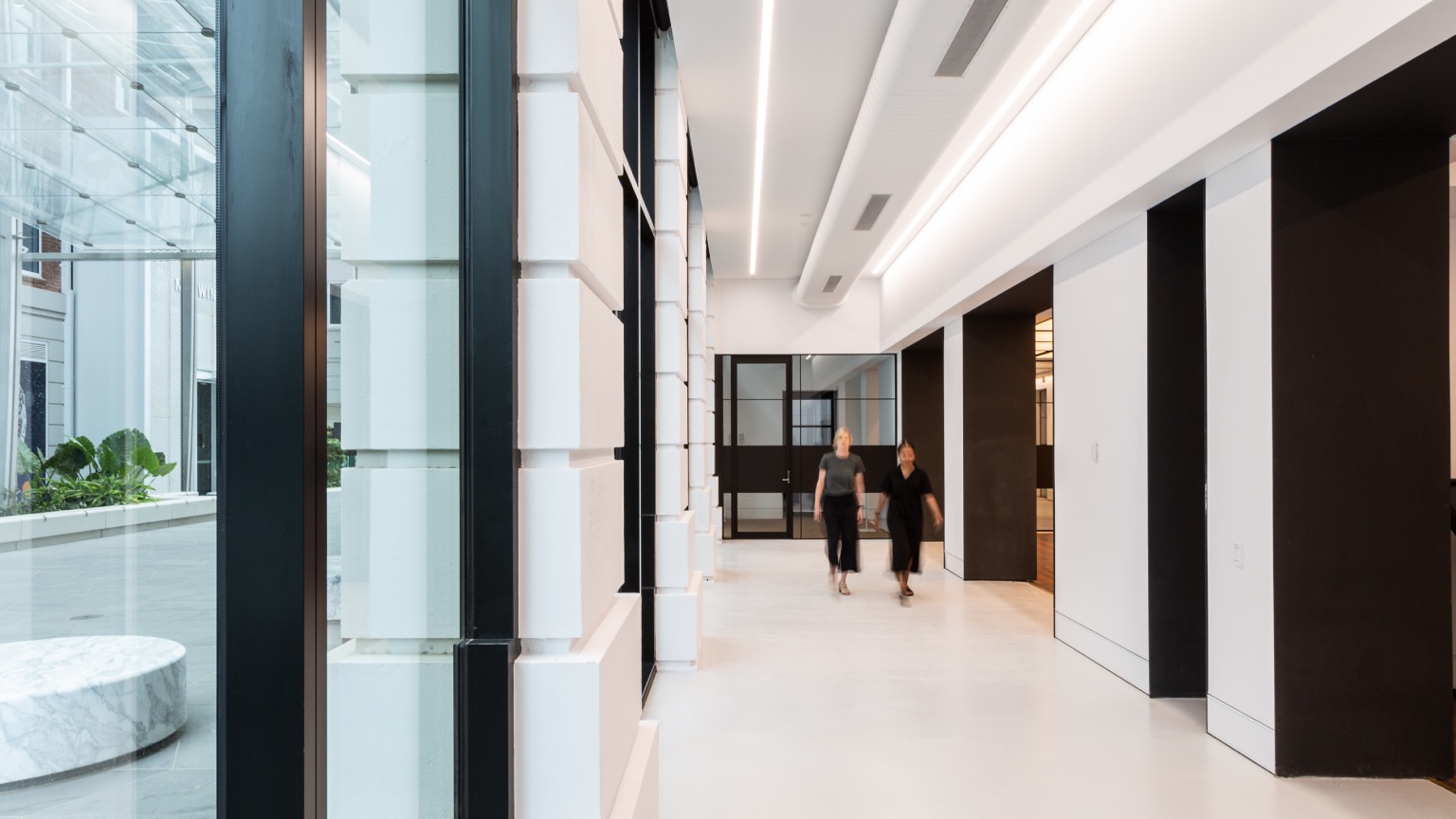 Light-coloured epoxy floor finish — Lot Fourteen Bice Building fitout corridor