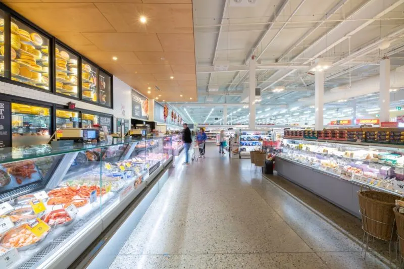 Polished concrete floor with aggregate exposure — Coles Victor Harbour deli and seafood aisle