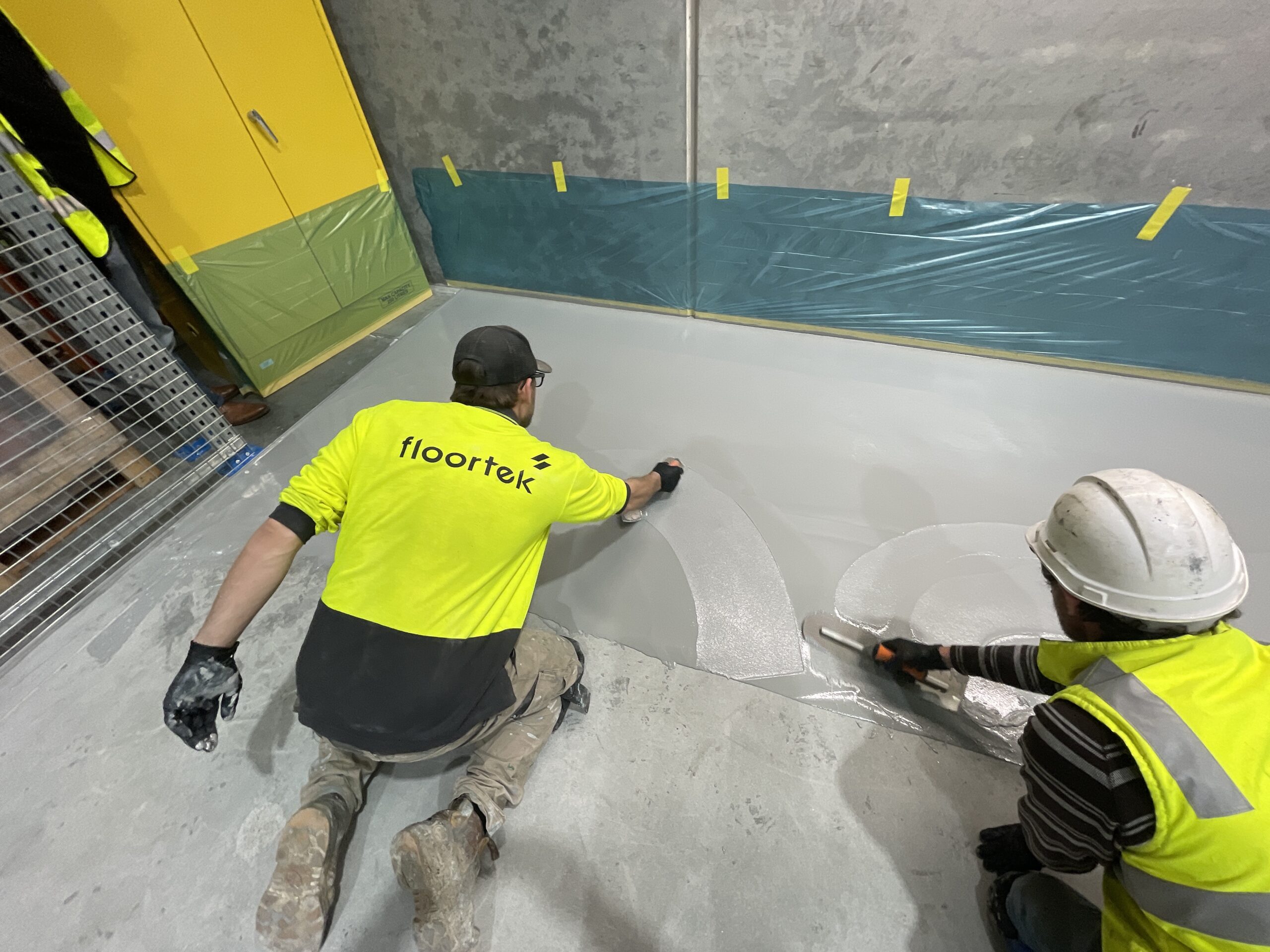 Floortek crew hand-trowelling PU cement system — FOSROC Flextool Tech Hub