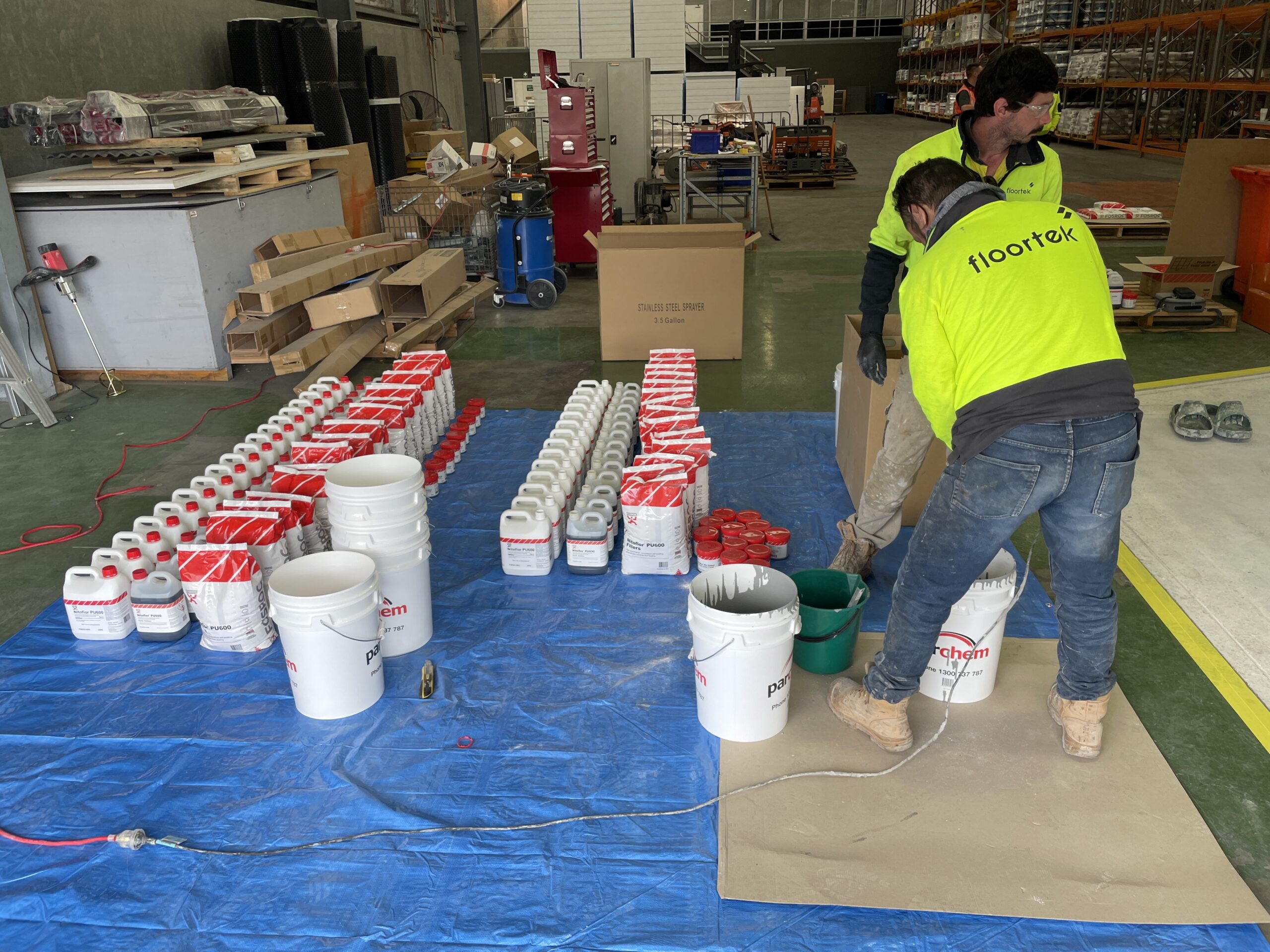 Floortek crew preparing PU cement material — FOSROC Flextool Tech Hub