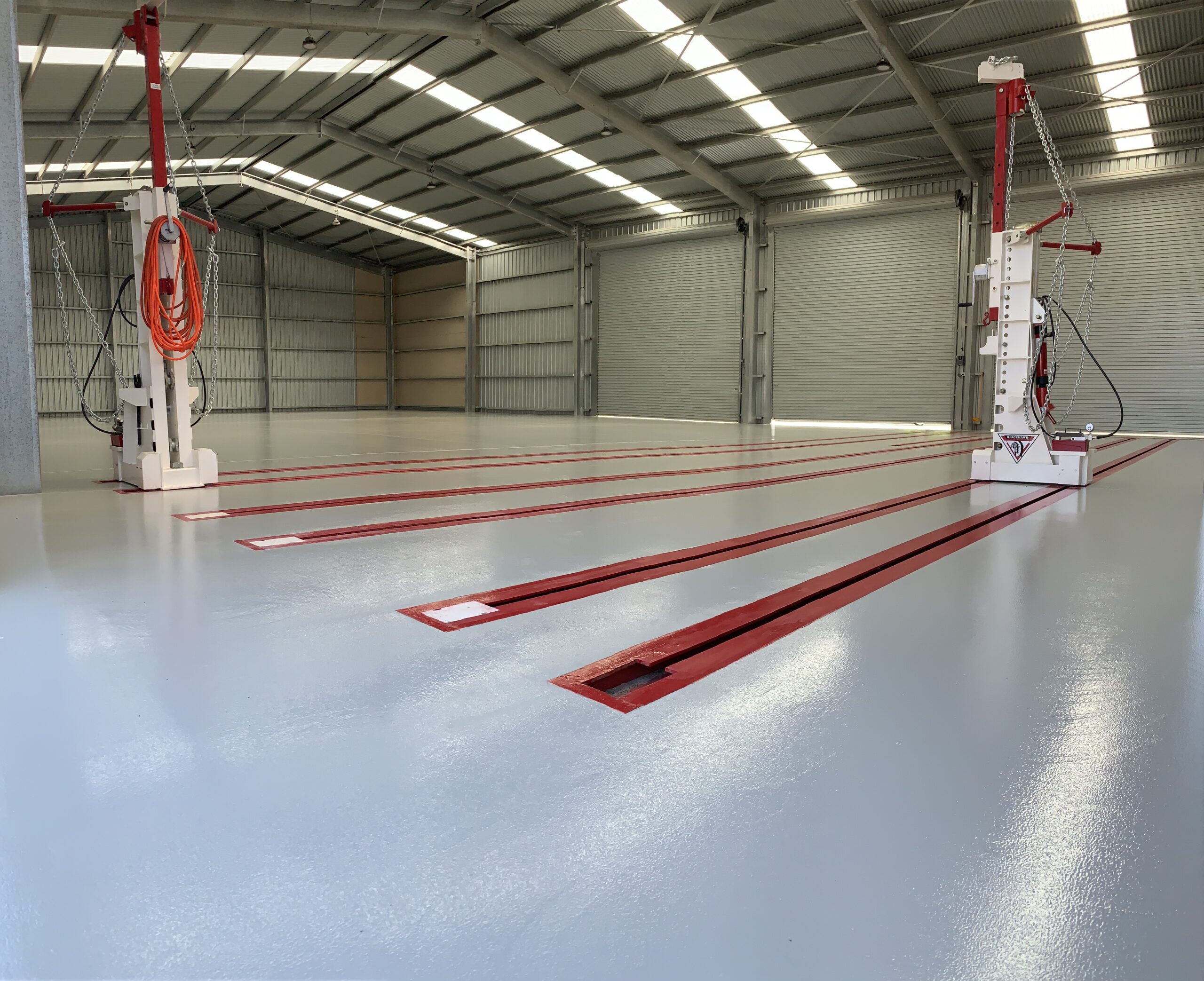 Roller-applied epoxy with PU topcoat — Mikutta vehicle repair workshop Adelaide