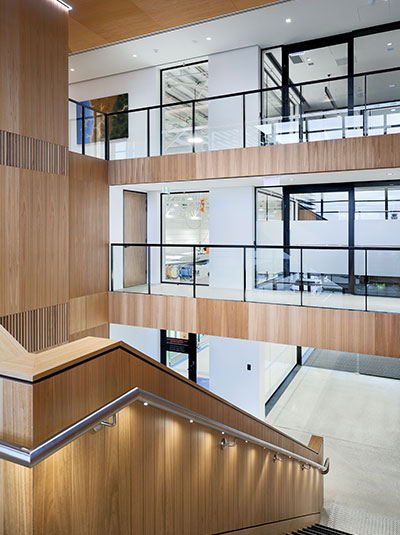 Aerial view of atrium staircase over polished concrete — Pilatus Adelaide Airport