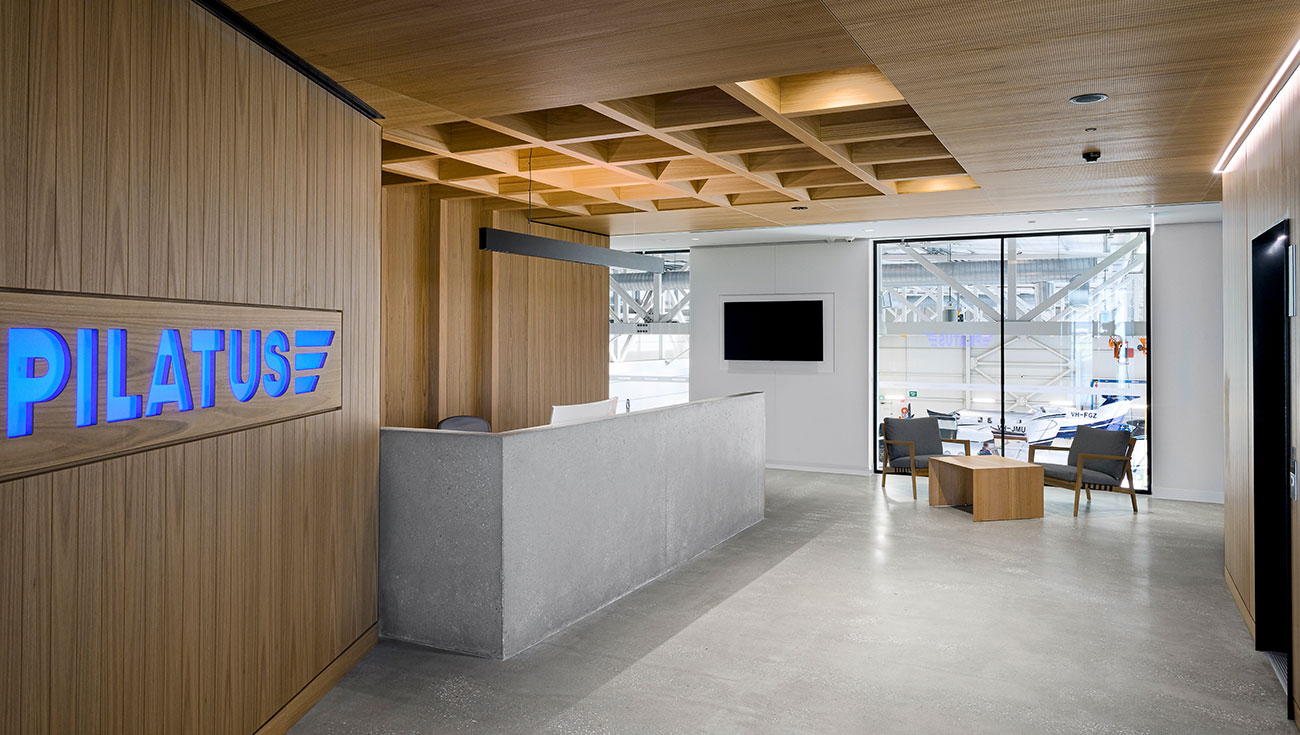 Reception lobby with polished concrete floor — Pilatus Adelaide Airport