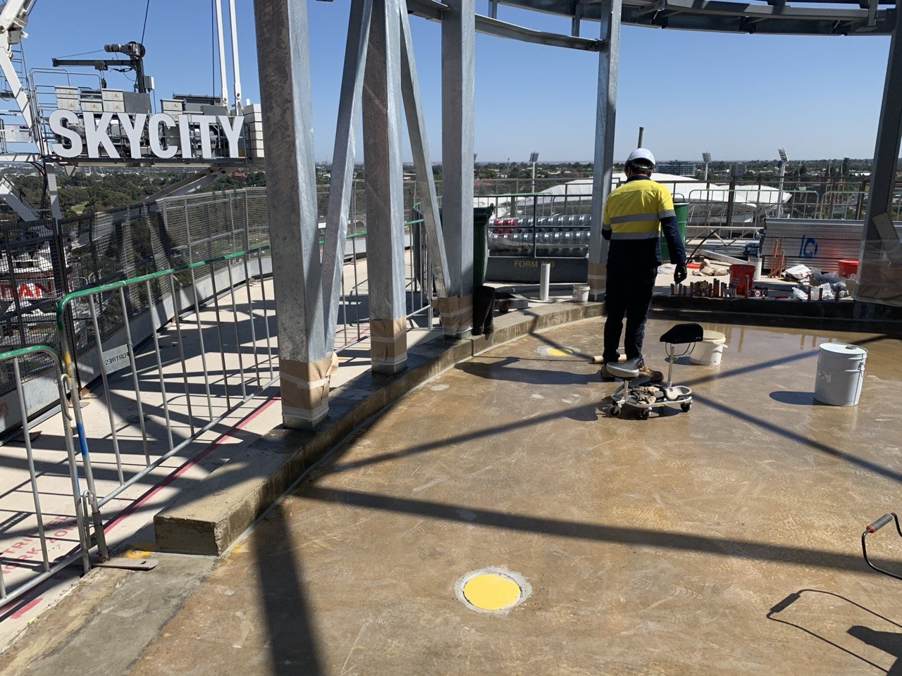 Floortek crew applying waterproofing membrane on SkyCity rooftop — SkyCity Adelaide Casino expansion
